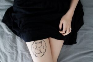 A girl have tattoo in her leg