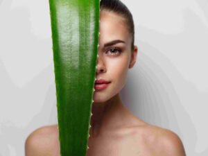 Women with green aloe leaf