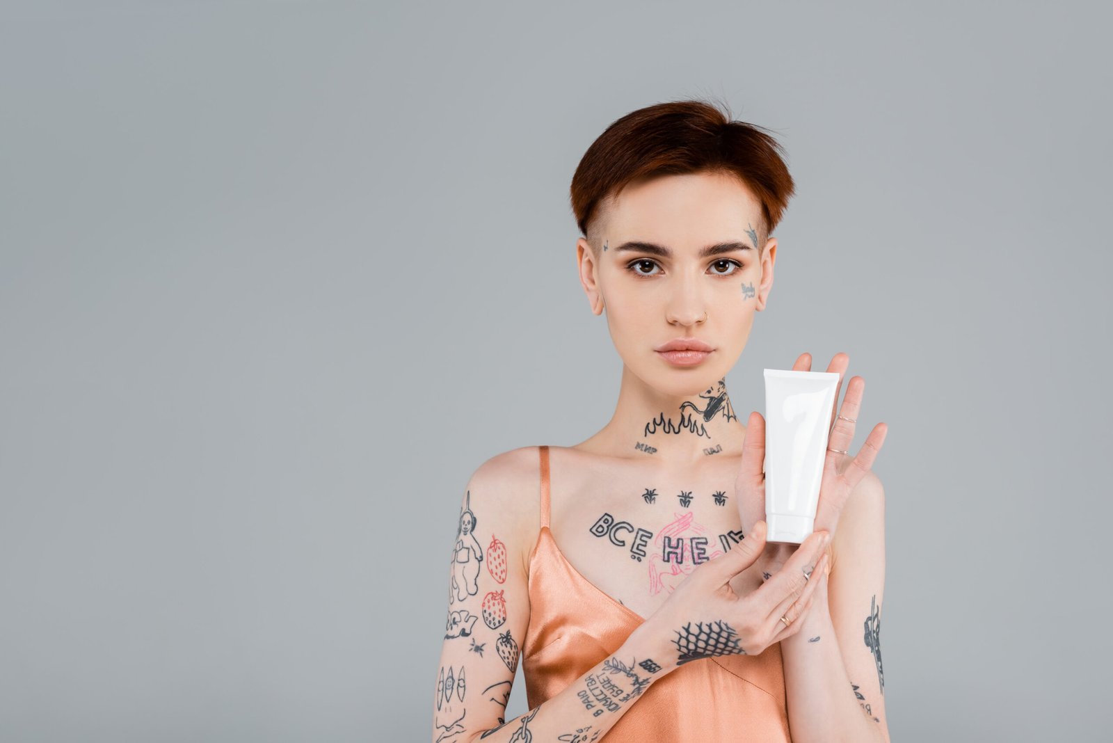 A young women holding a sun cream