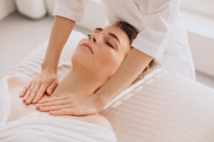 Woman having face massage