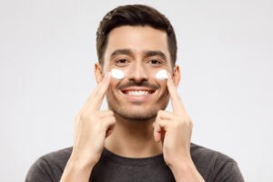 A man applying face cream