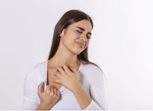 Young women scratching her neck due itching