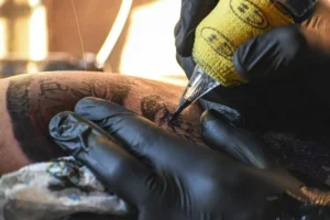 A man remove his Sternum Tattoos